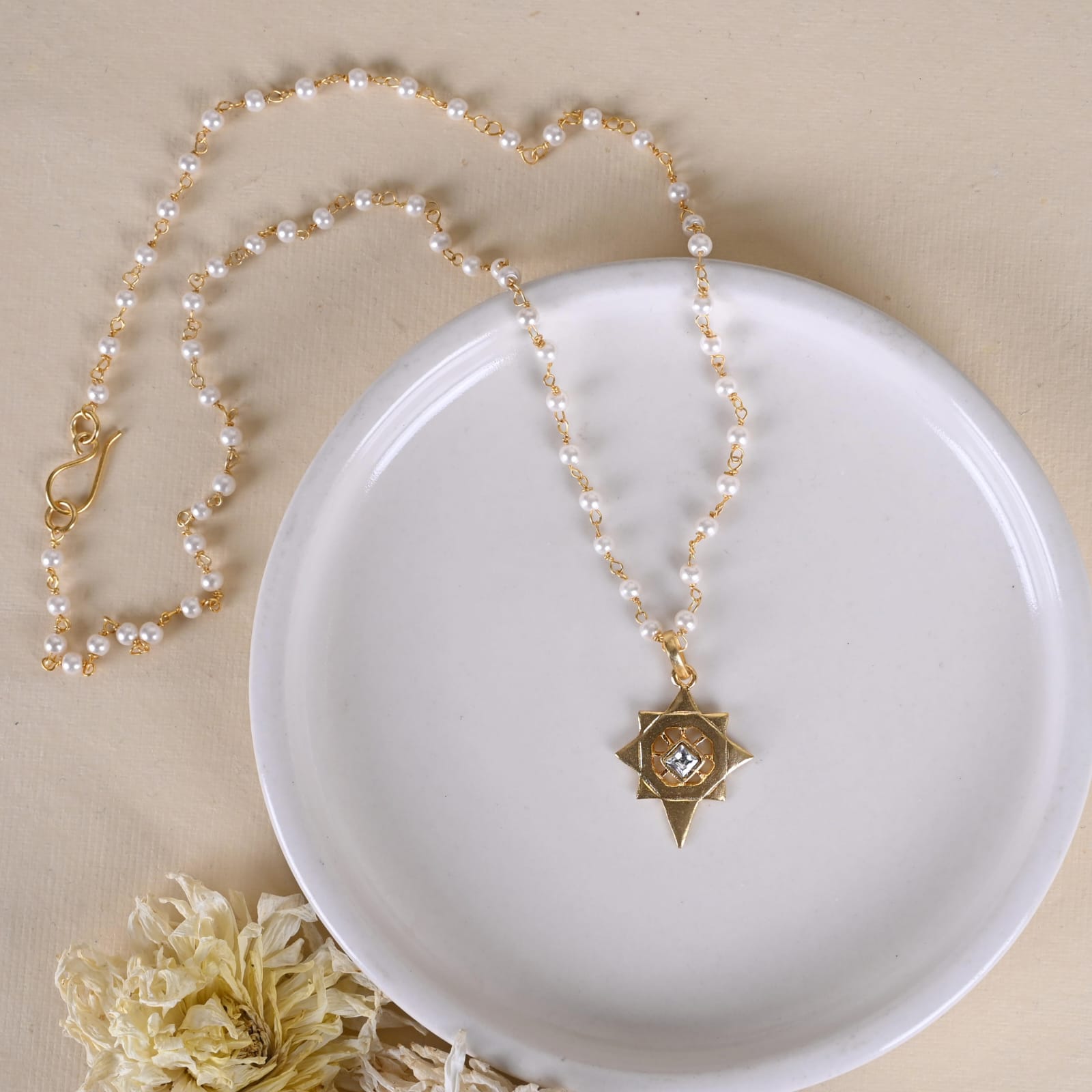 Jayanti pendant handcrafted in 92.5 Sterling Silver dipped in 1 micron Gold plating in antique finish.