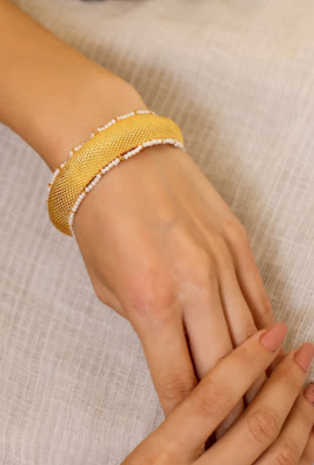 92.5 Sterling Silver and Gold plated bangle with textured Gold plated and Pearl around the bangles.