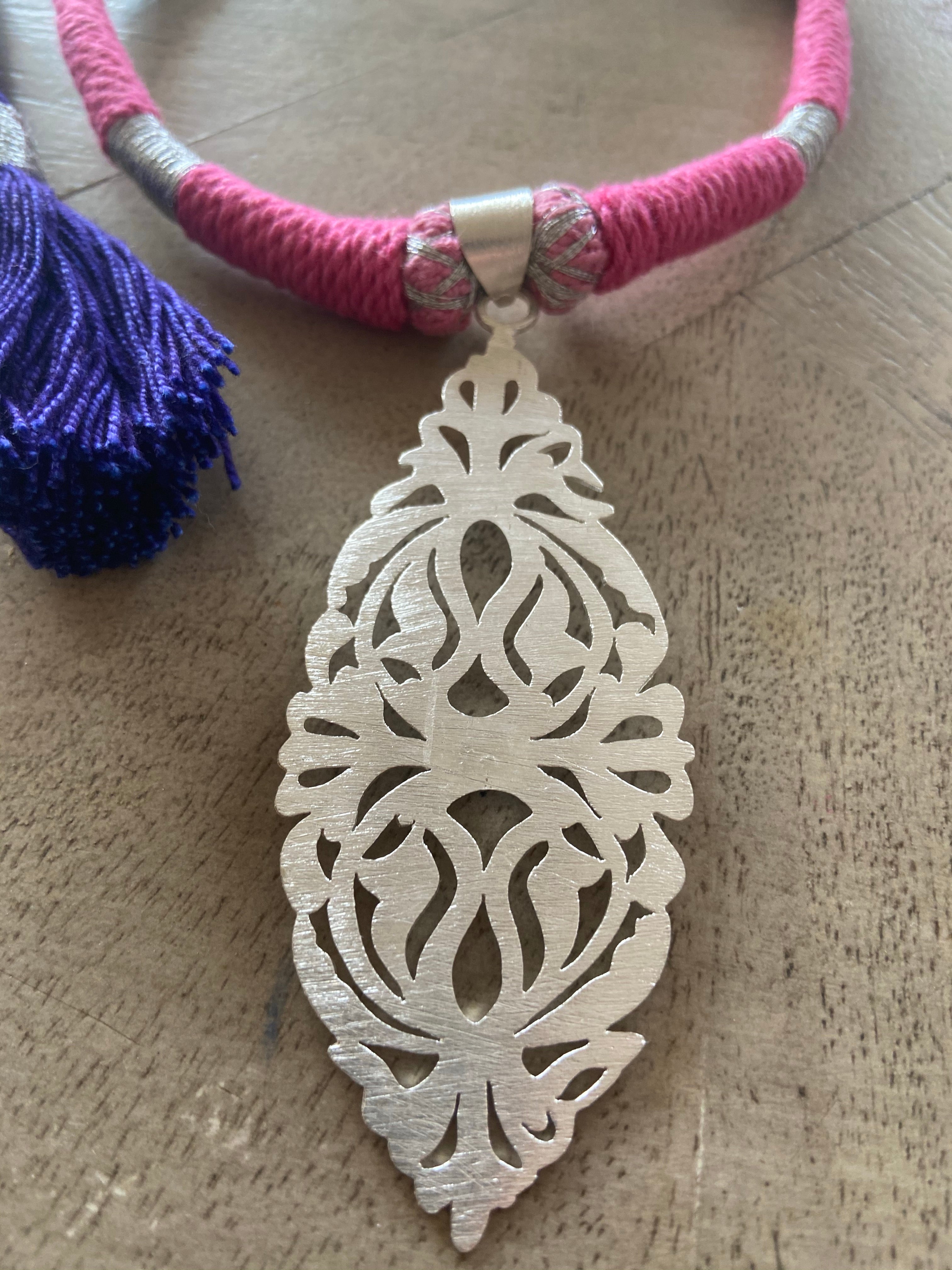 Silver pendent thread work