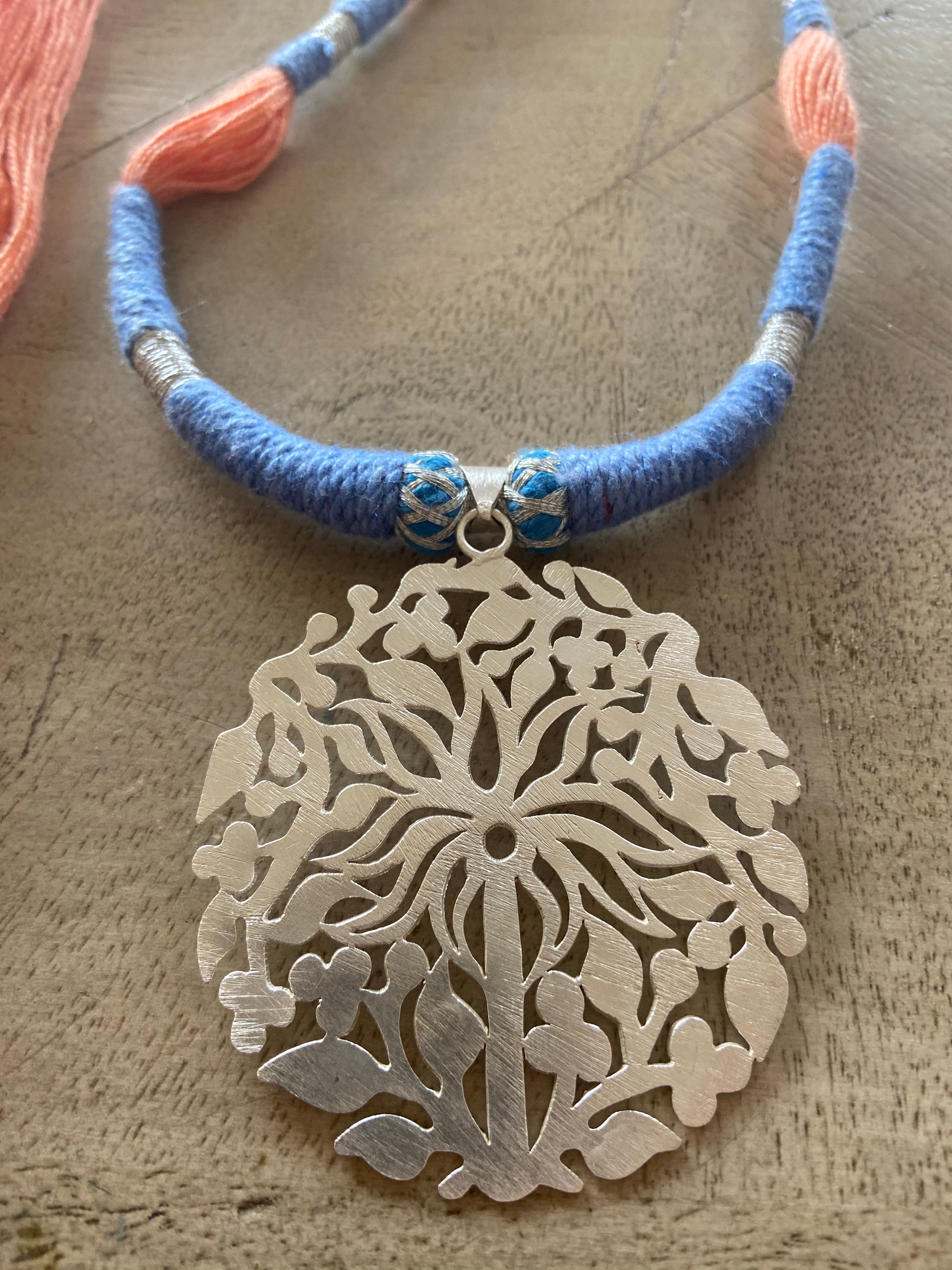 Silver pendent palm tree with thread work