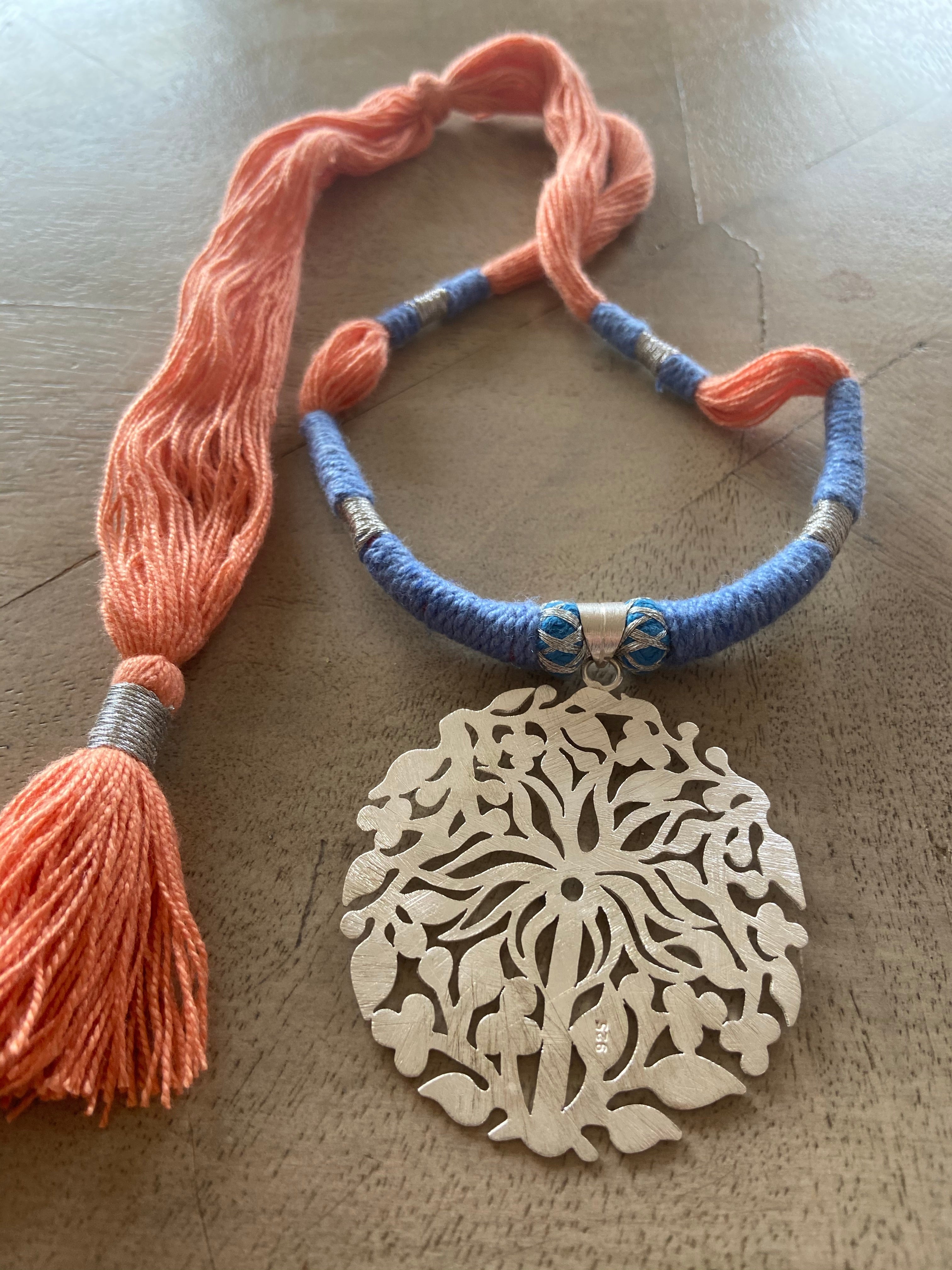 Silver pendent palm tree with thread work