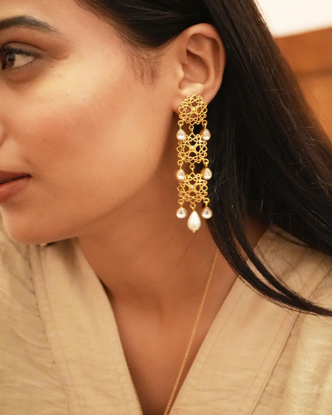 Charu Earrings handcrafted in 92.5
Sterling Silver, dipped in 1 micron Gold plating, Filligiri earrings with Polki and Pearls.