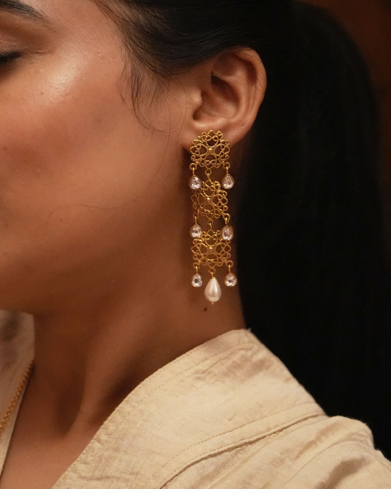 Charu Earrings handcrafted in 92.5
Sterling Silver, dipped in 1 micron Gold plating, Filligiri earrings with Polki and Pearls.