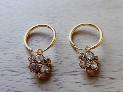 Flower hoops 
Sterling silver hoops with 18 k gold plating 
Cubic zircons