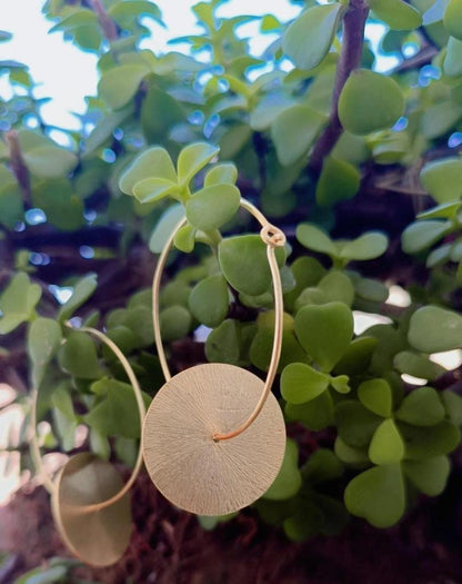 Silver gold plated disc earrings 
Hammered discs