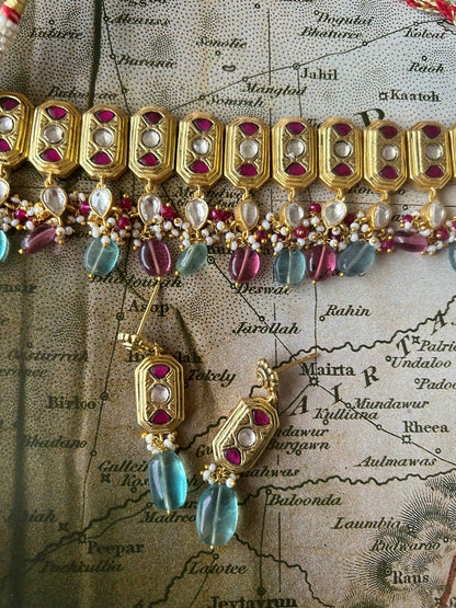 Handcrafted silver choker with earrings, Palash work and Pearls and floride stones.