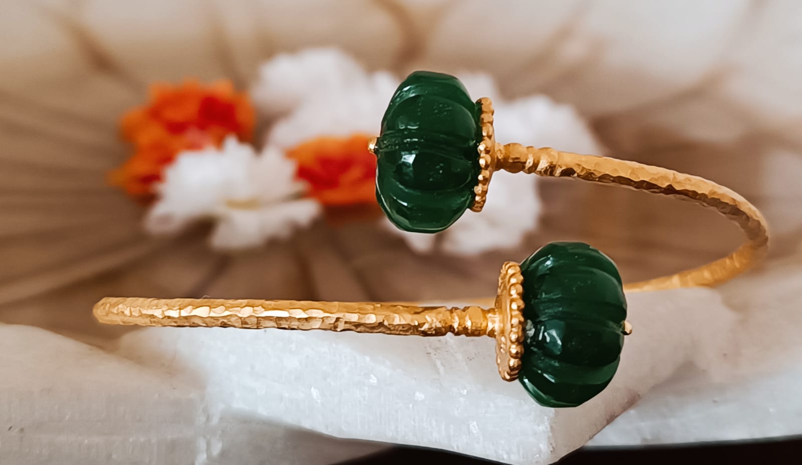 Sterling silver adjustable bracelet with 24 karat gold plating, Carved green aventurine stones. 