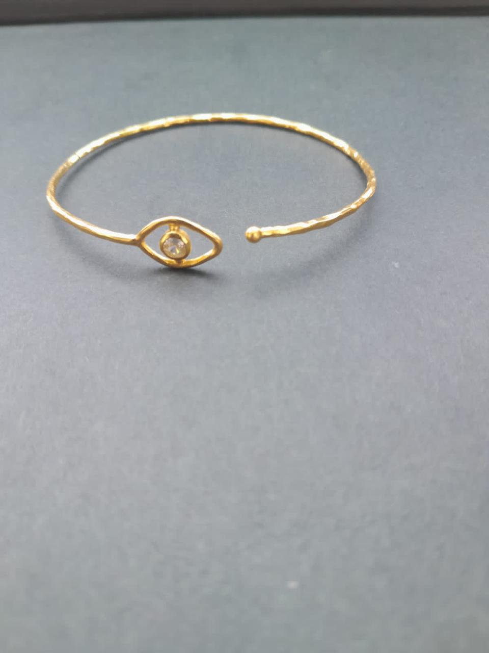 Evil Eye Sterling silver adjustable bracelet with 24 karat gold plating and Crystal.