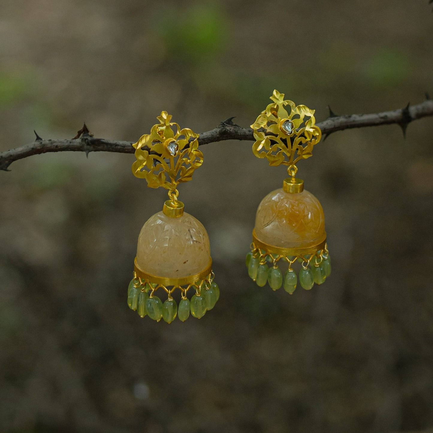 Yellow aventurine carved jhumka peridot drops, Sterling silver with 24 karat gold plating.