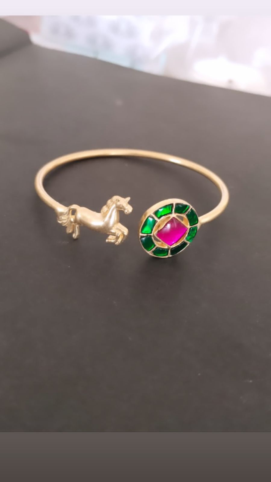 Sterling silver adjustable bracelet with pink and green Jadau stones, 24 karat micron gold plating.
