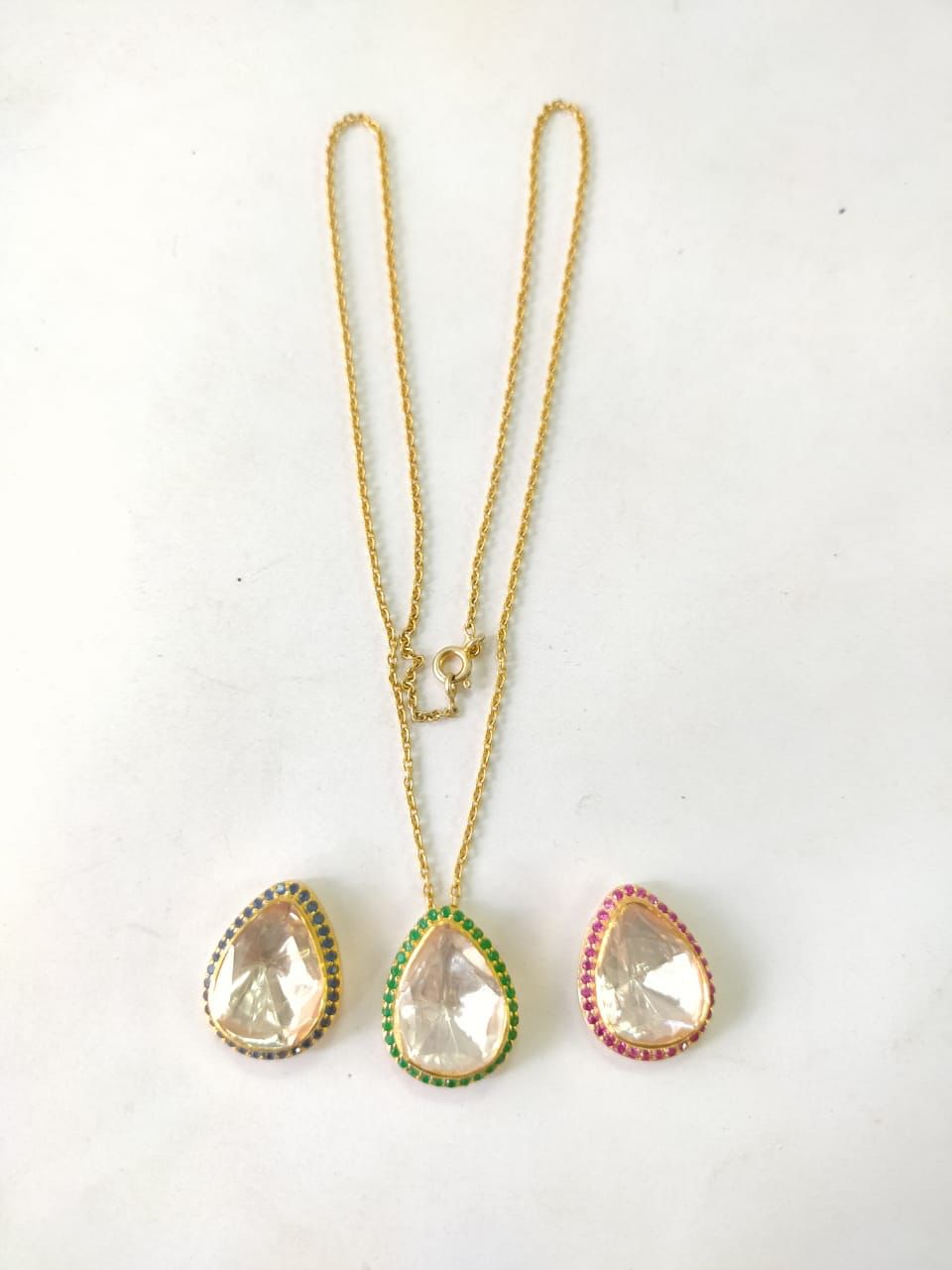 Three in a one Drop pendant necklace: 
Ruby red, Emerald green and blue Sapphire stones with Moissanite Diamond set in sterling Silver and
1 micron gold plating