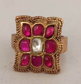 Chaukor phool Ring Sterling Silver ring with red Jadau stones in 18 carat gold plating.