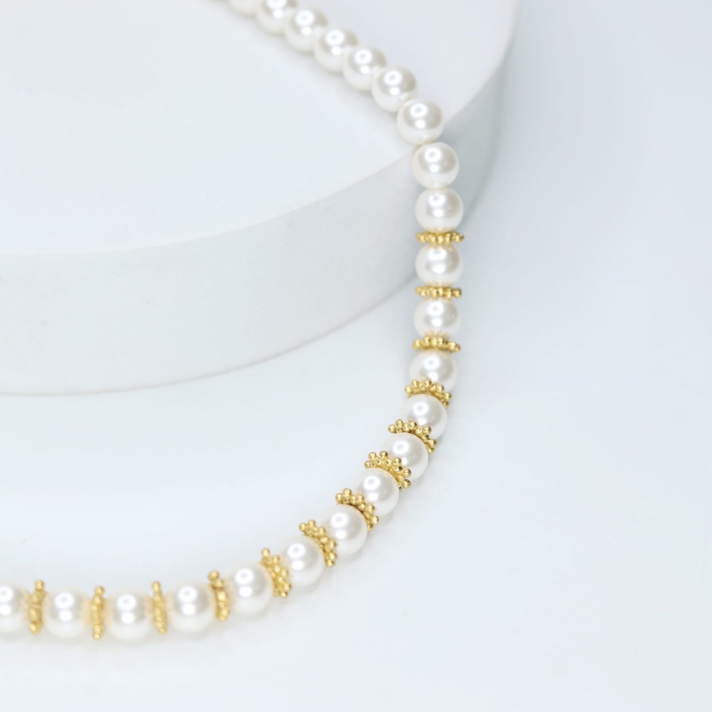 Swarovski pearl necklace with sterling Silver, Gold plated rounds.

Length 17 inches.