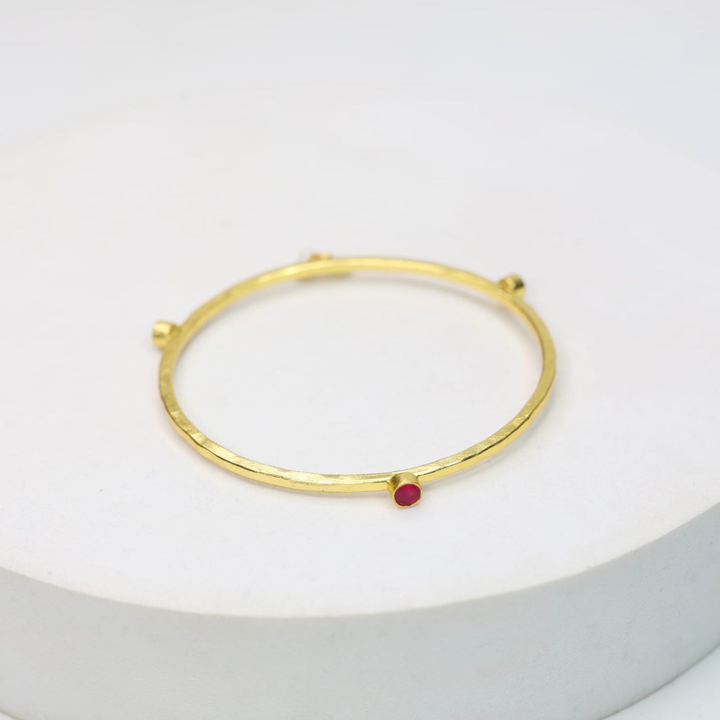 Stacking Bracelet/Bangle in 
92.5 sterling silver in 18 karat Gold plating with Pearls and red Quartz.