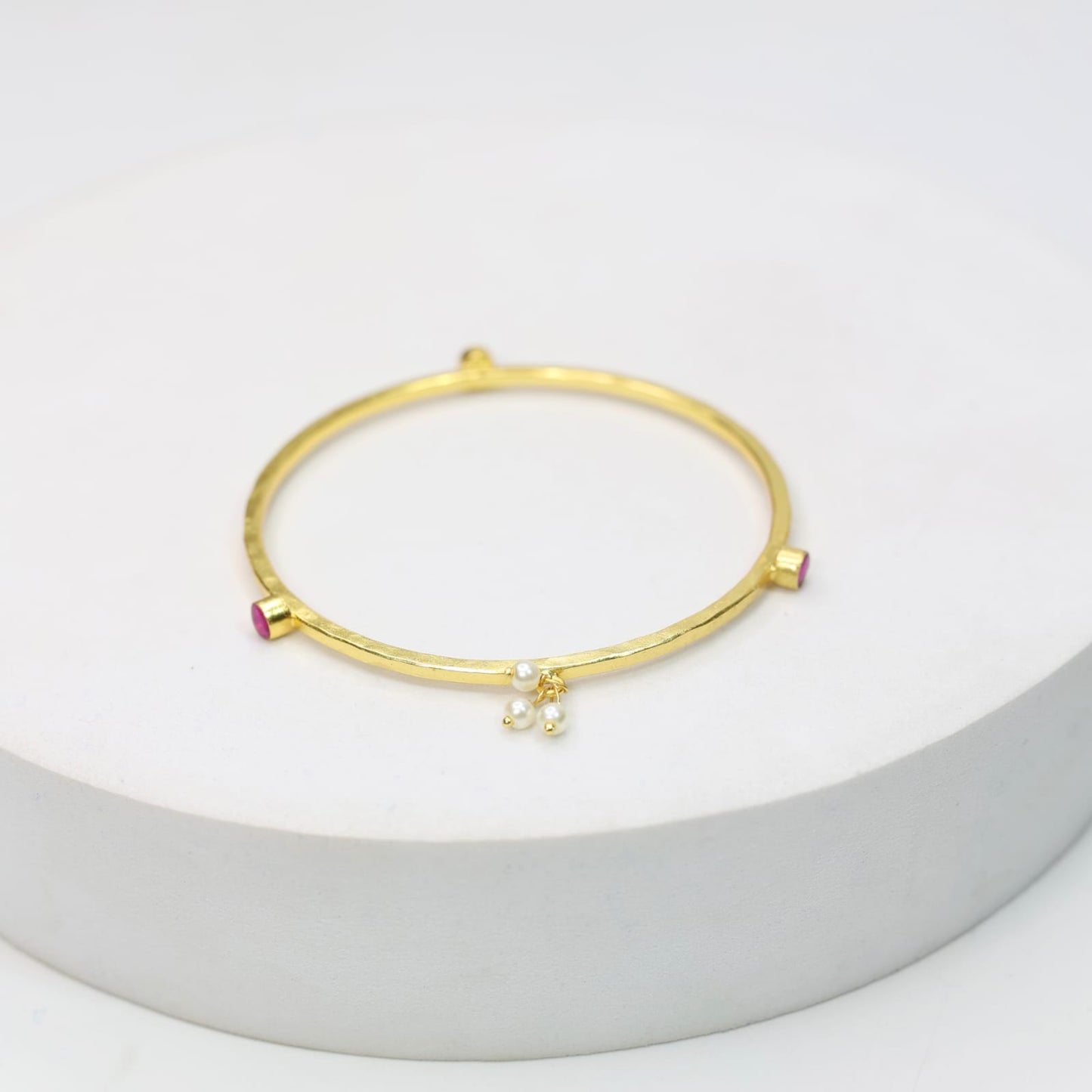 Stacking Bracelet/Bangle in 
92.5 sterling silver in 18 karat Gold plating with Pearls and red Quartz.