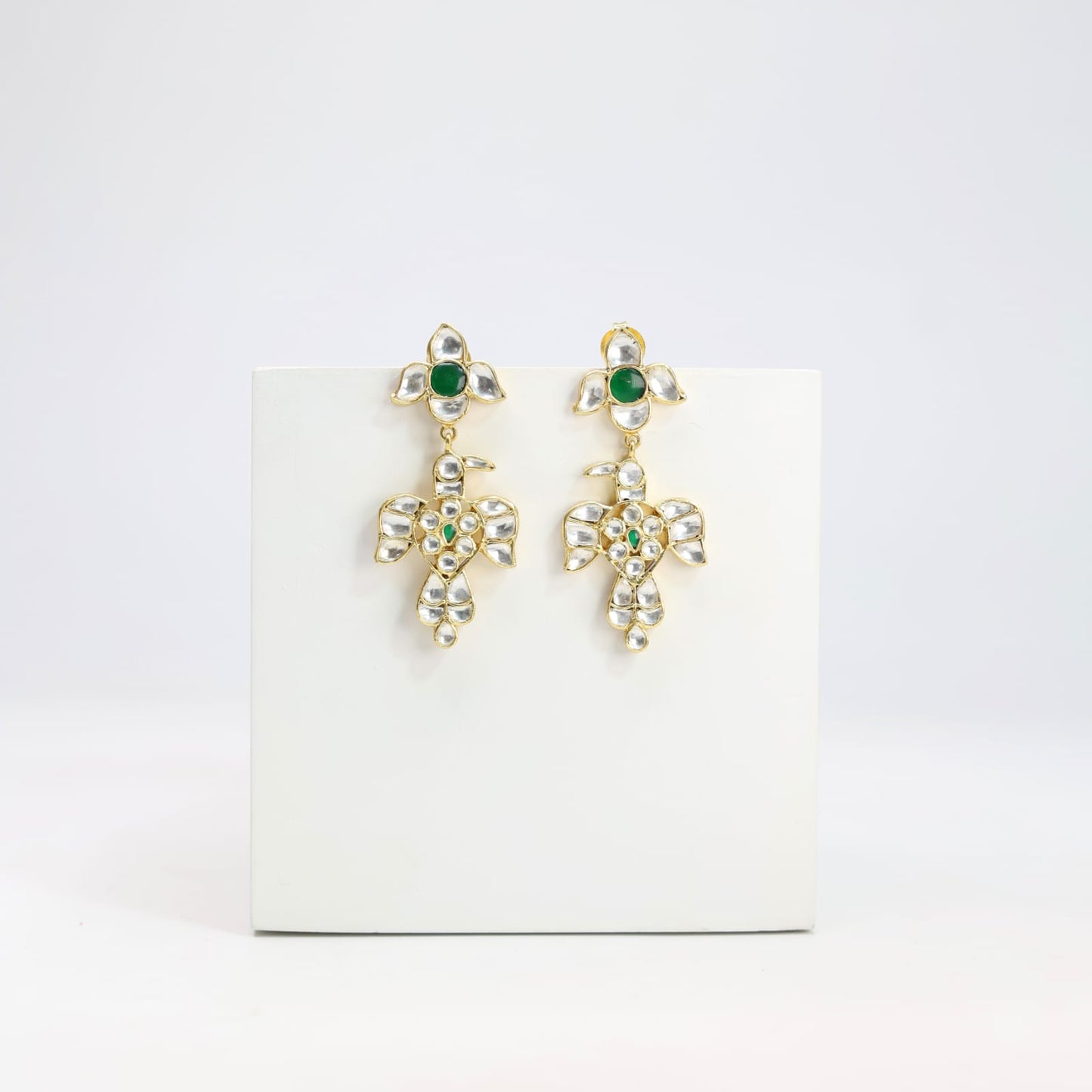 Baaz earrings in Jadau in Sterling Silver with billor Polki and green Onyx stones in 1 micron gold plating with Push-Post closure.