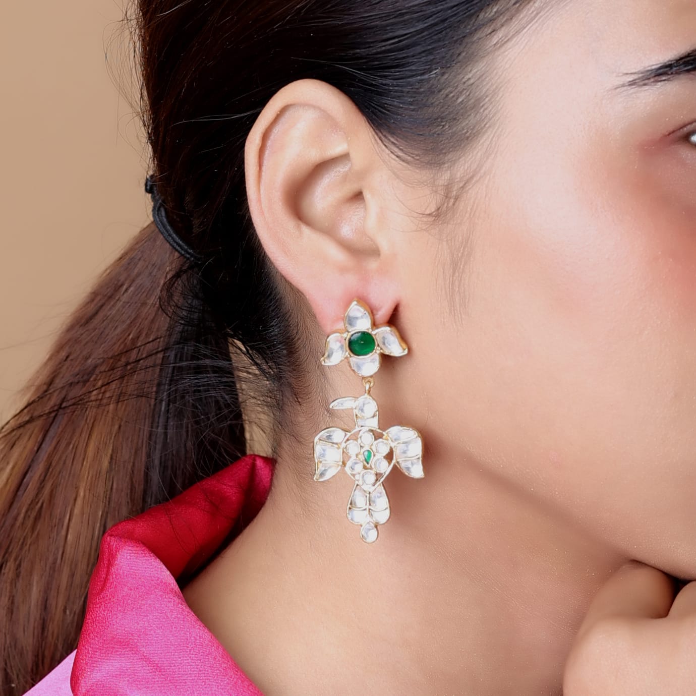 Baaz earrings in Jadau in Sterling Silver with billor Polki and green Onyx stones in 1 micron gold plating with Push-Post closure.