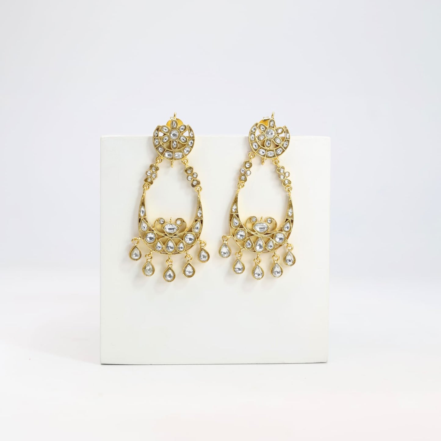 Chandbaali earrings in Jadau in sterling Silver with billor Polki in 
1 micron gold plating.
Push-Post closure.