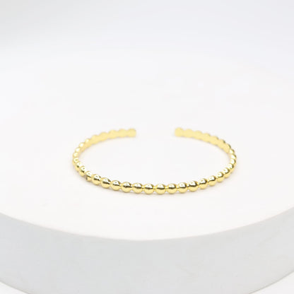 Handcrafted sterling Silver bracelet with 1 micron gold plating with
Textured open stacking. 
Size- Adjustable.