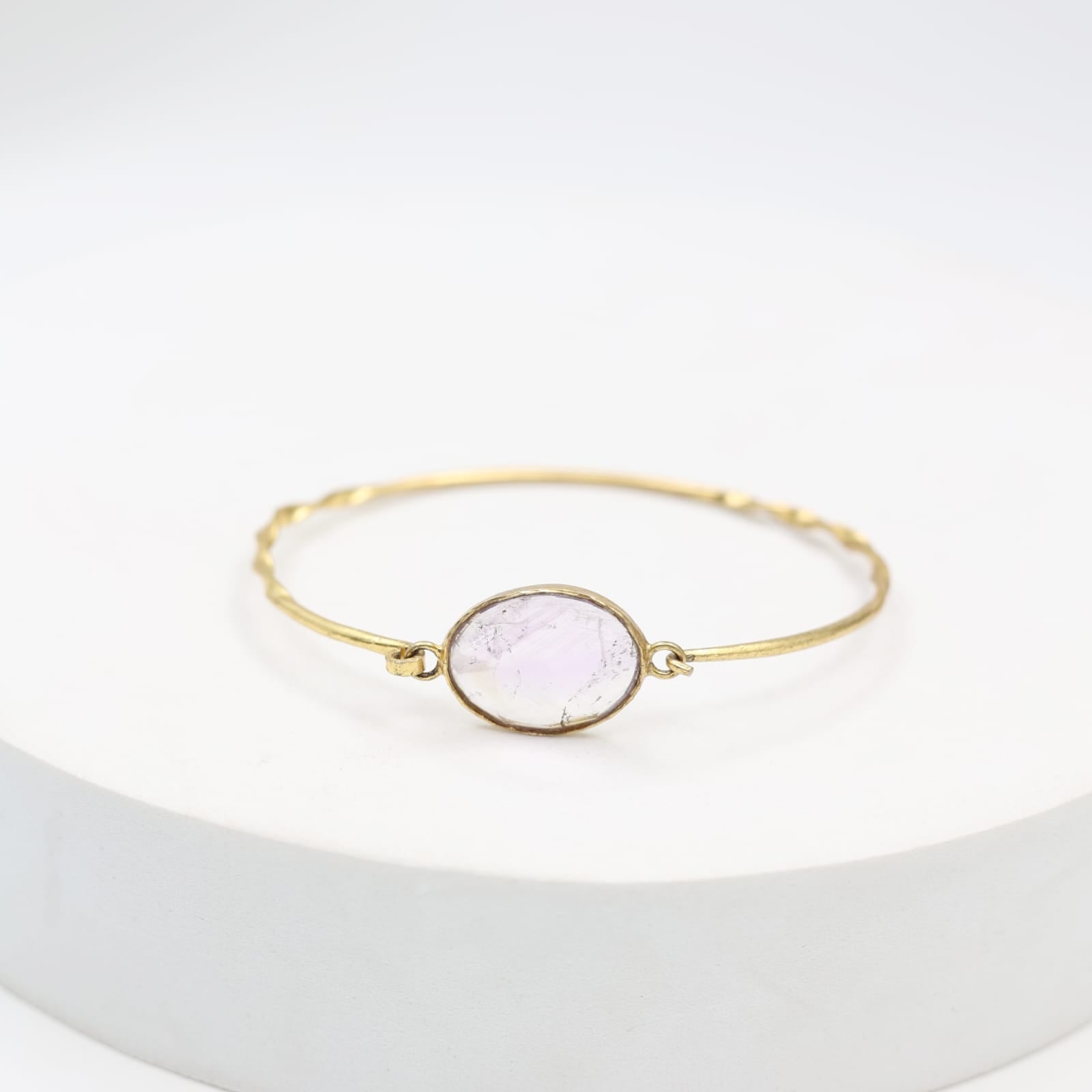 Handcrafted Amethyst bracelet in sterling silver studded with faceted amethyst stone in 1 micron gold plating.