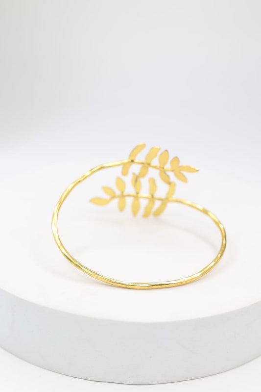 Silver alloy bracelet with 1 micron gold plating in textured design, adjustable.