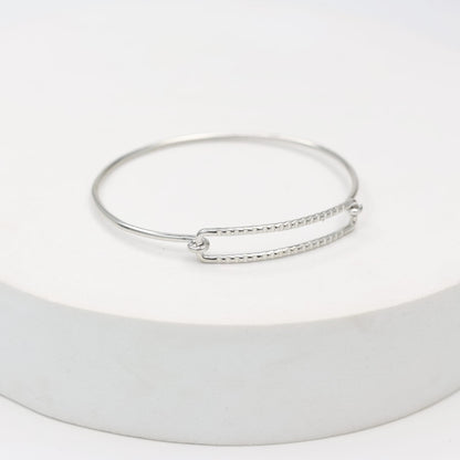 Sterling Silver stacking bracelet in a geometric shape with twisted wire, made to size.