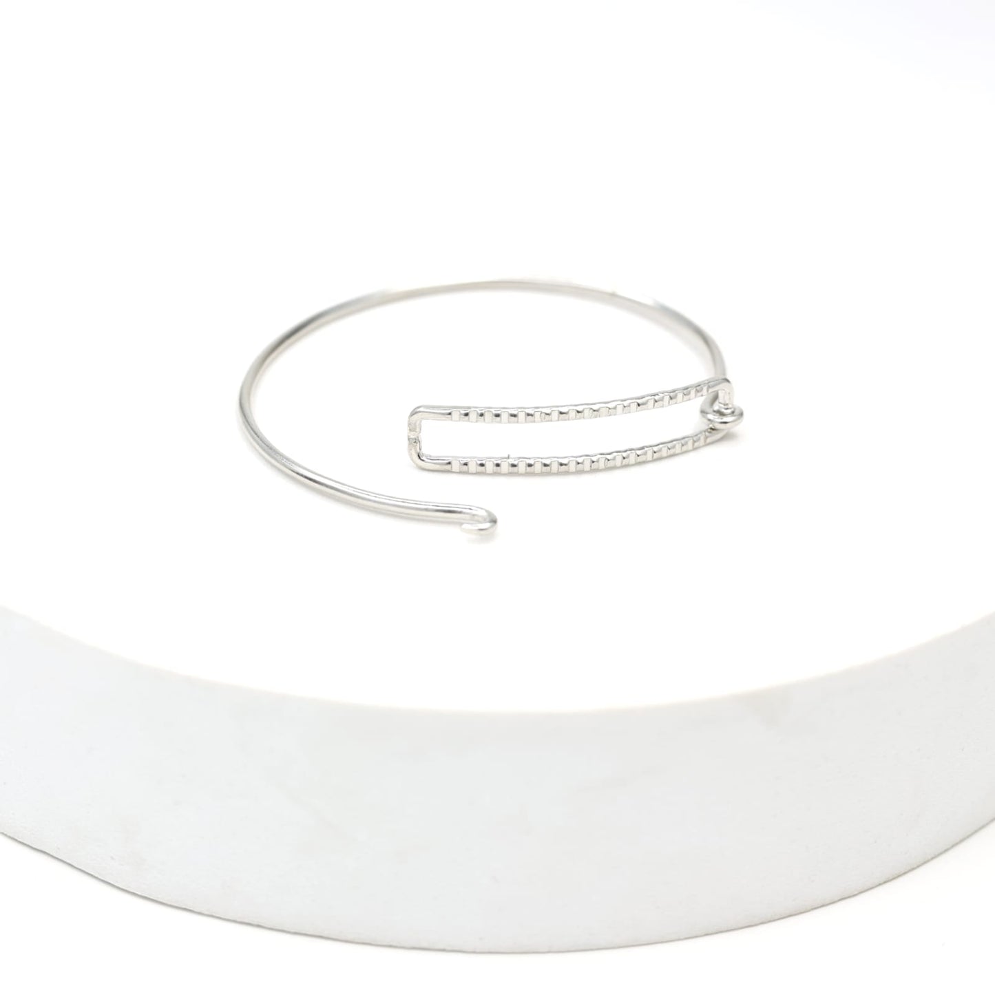 Sterling Silver stacking bracelet in a geometric shape with twisted wire, made to size.