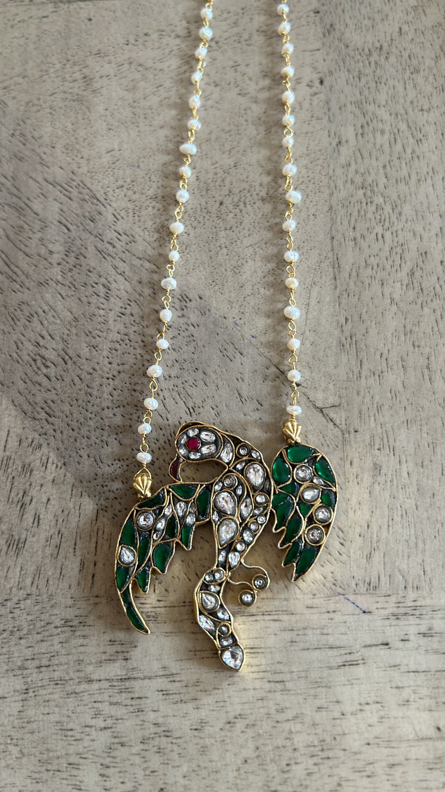 Parinda pendant in Sterling Silver necklace with jadau in a fresh water pearl chain with 18 carat micron plating with thread sarafa closure.