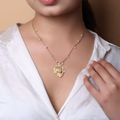 Sterling Silver Pendant necklace with rose Quartz and textured leaves motif in 18 karat Gold plating.