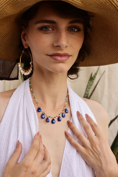 Raindrops necklace in 92.5 Sterling Silver with Lapis Lazuli strung with turquoise and pearls in 1 micron Gold plating. 
Length- 16-18 inches adjustable.