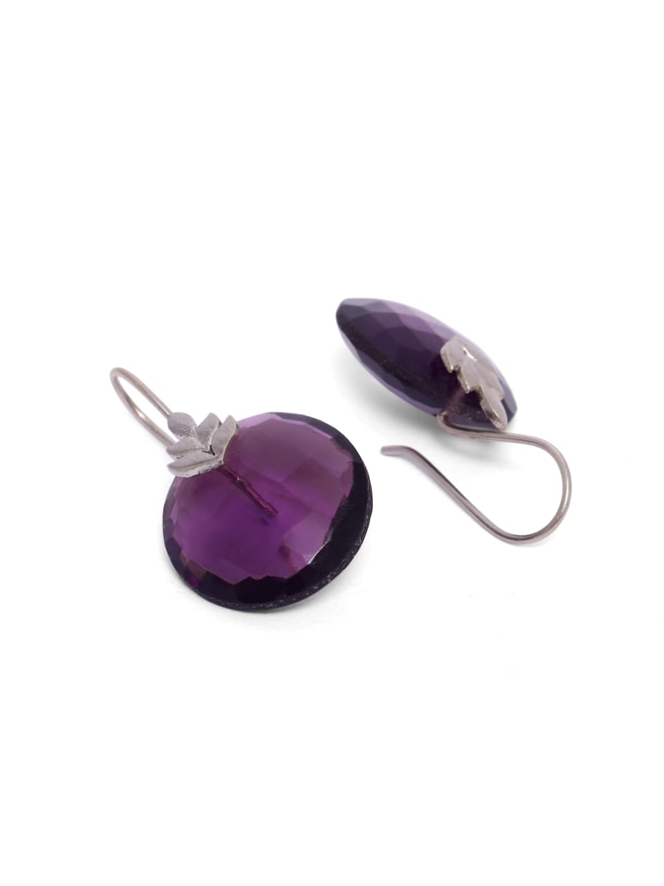 Nazara earrings in 92.5 Sterling Silver in a Silver leaf with an Amythest disk.