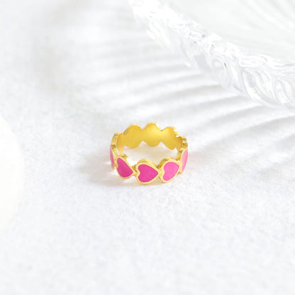 Ishq ring with Fuschia Enamel in 92.5 Sterling Silver dipped in 1 micron Gold plating.