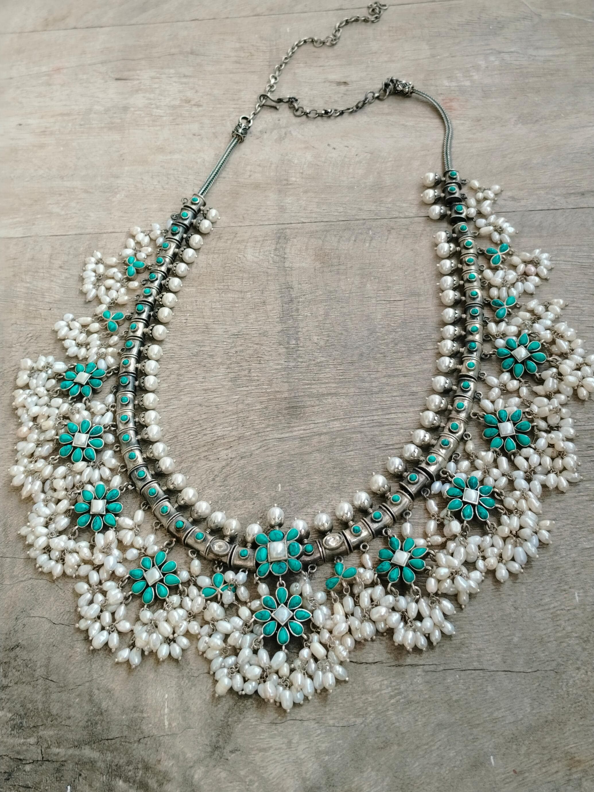 Maanvi necklace in 92.5 Sterling Silver handcrafted in Jadau Turquoise with rice Pearls.