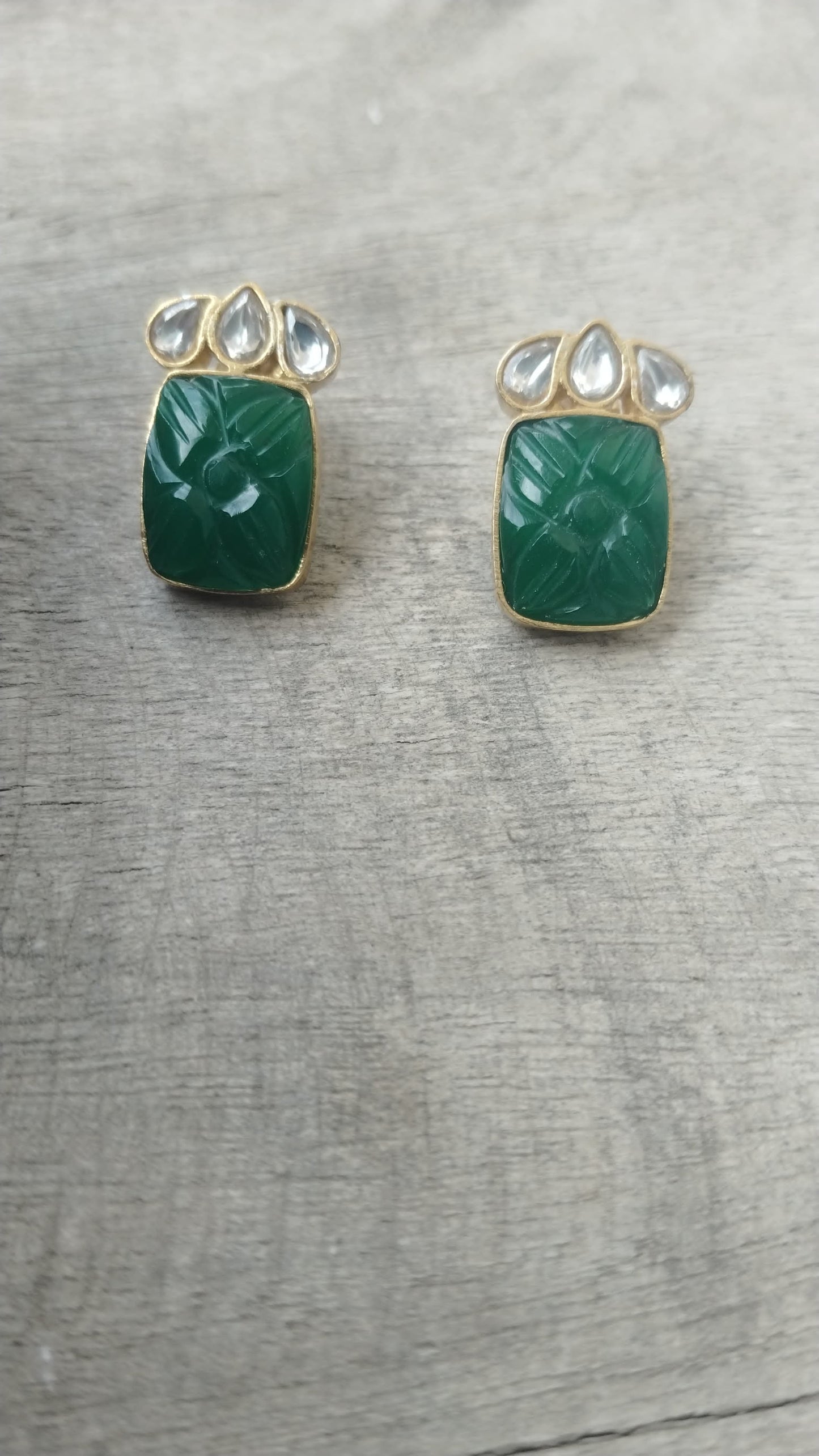 Tabassum earrings/studs in 92.5 Sterling Silver handcrafted and dipped in 1 micron Gold plating in traditional green Onyx caved studs.