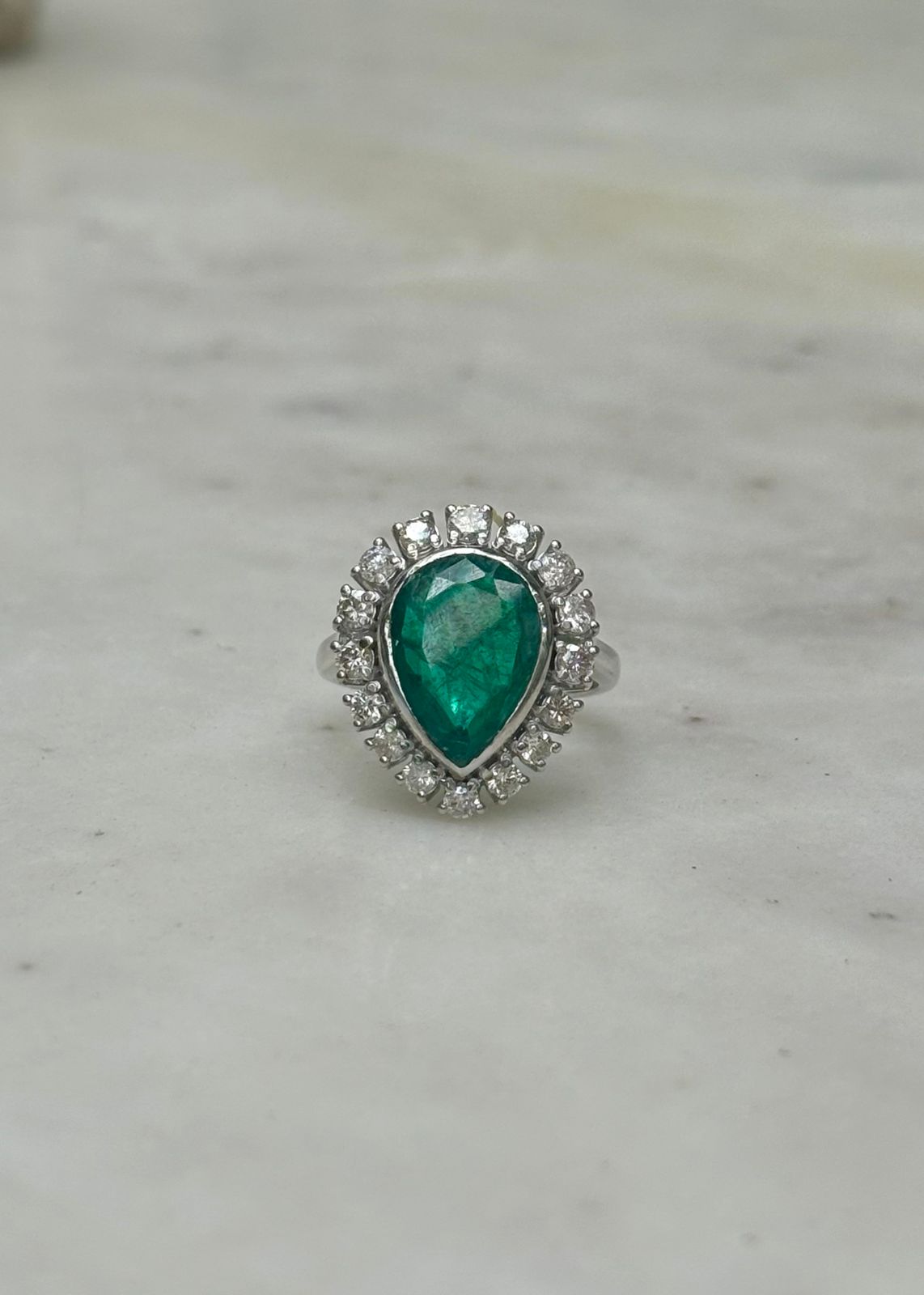 Pear shaped Emerald-Gold ring studded in Diamonds and Gold.