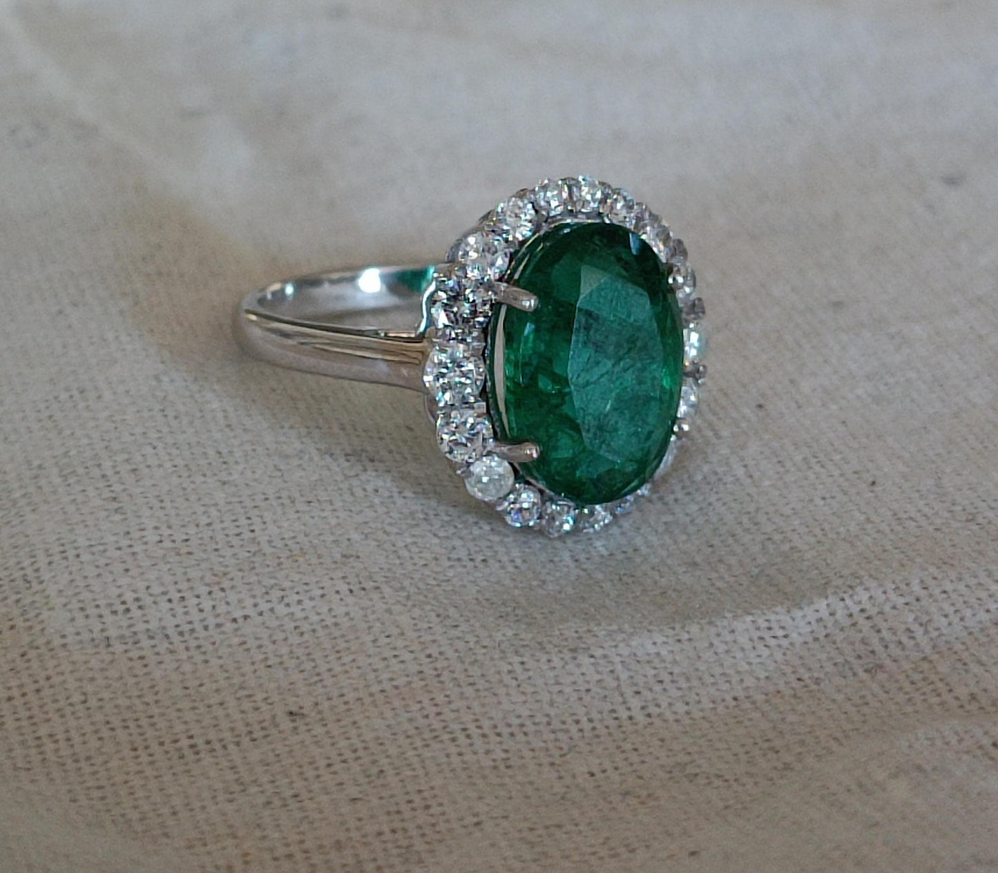 Emerald-Diamond Halo ring in 3.78g Gold.