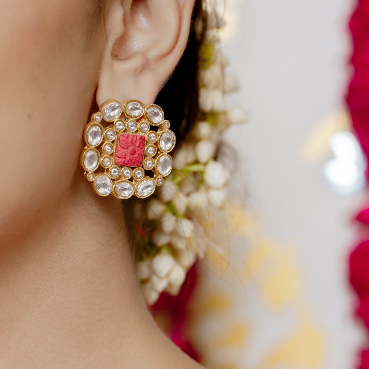 Kesari earrings in 92.5 Sterling Silver handcrafted and dipped in 1 micron Gold plating with Jadau-Polki in traditional coral carvings.