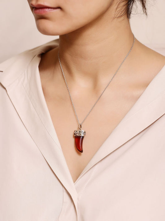 Surmui pendant in 92.5 Sterling Silver handcrafted and dipped in 1 micron Gold plating with antique Silver chain/pendant in red Onyx.