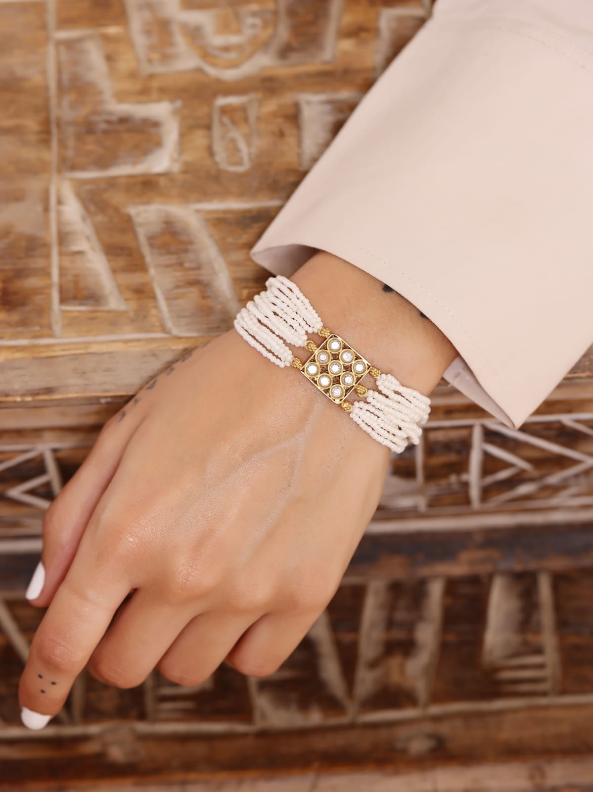 Amaya bracelet in 92.5 Sterling Silver handcrafted and dipped in 1 micron Gold plating with Jadau in traditional Pearls and Polki.