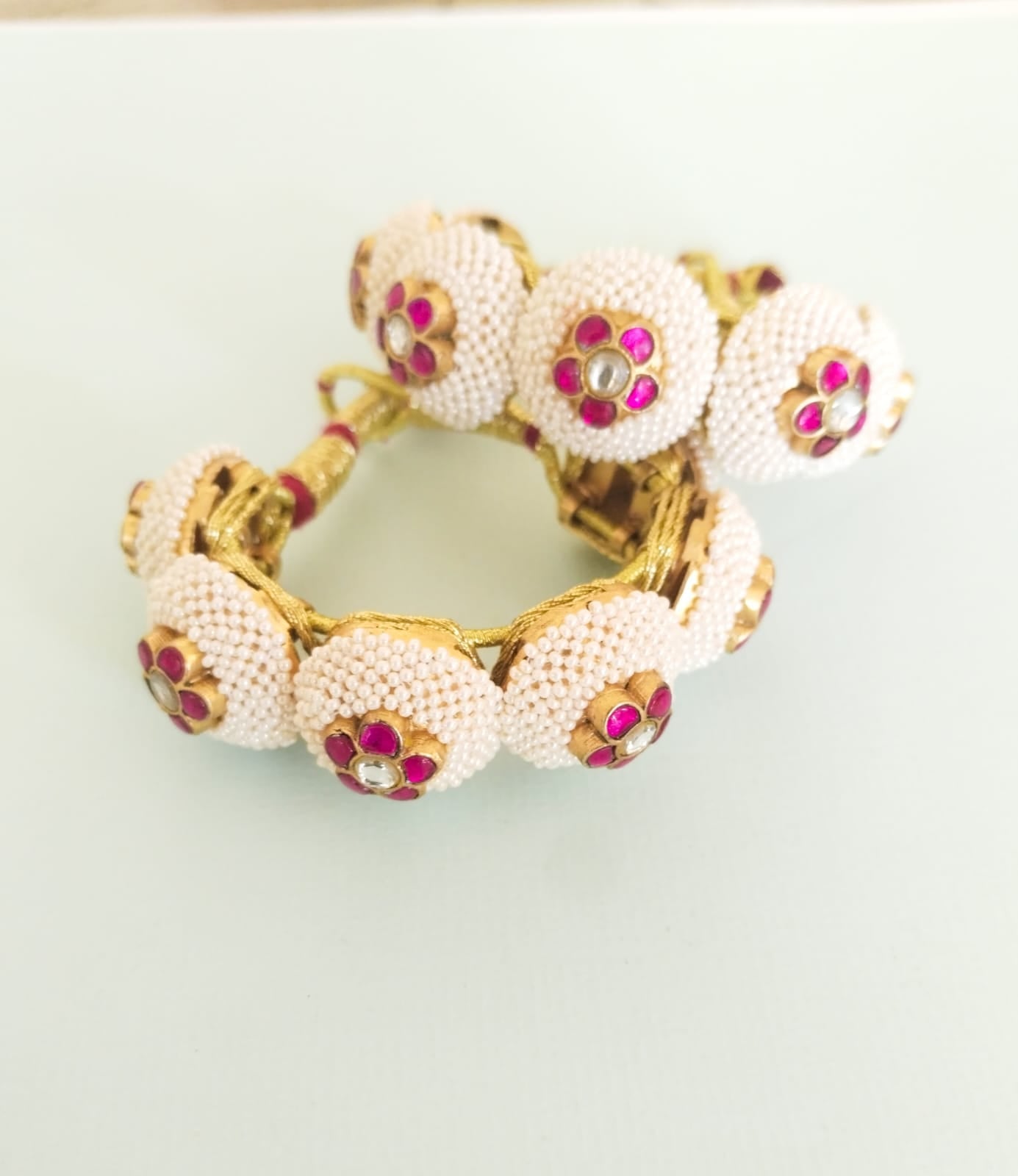 Red pearl phunchi/bracelet in 92.5 Sterling Silver handcrafted and dipped in 1 micron Gold plating with Puwain-Jadau in traditional Paunchi (Price for 1 piece).