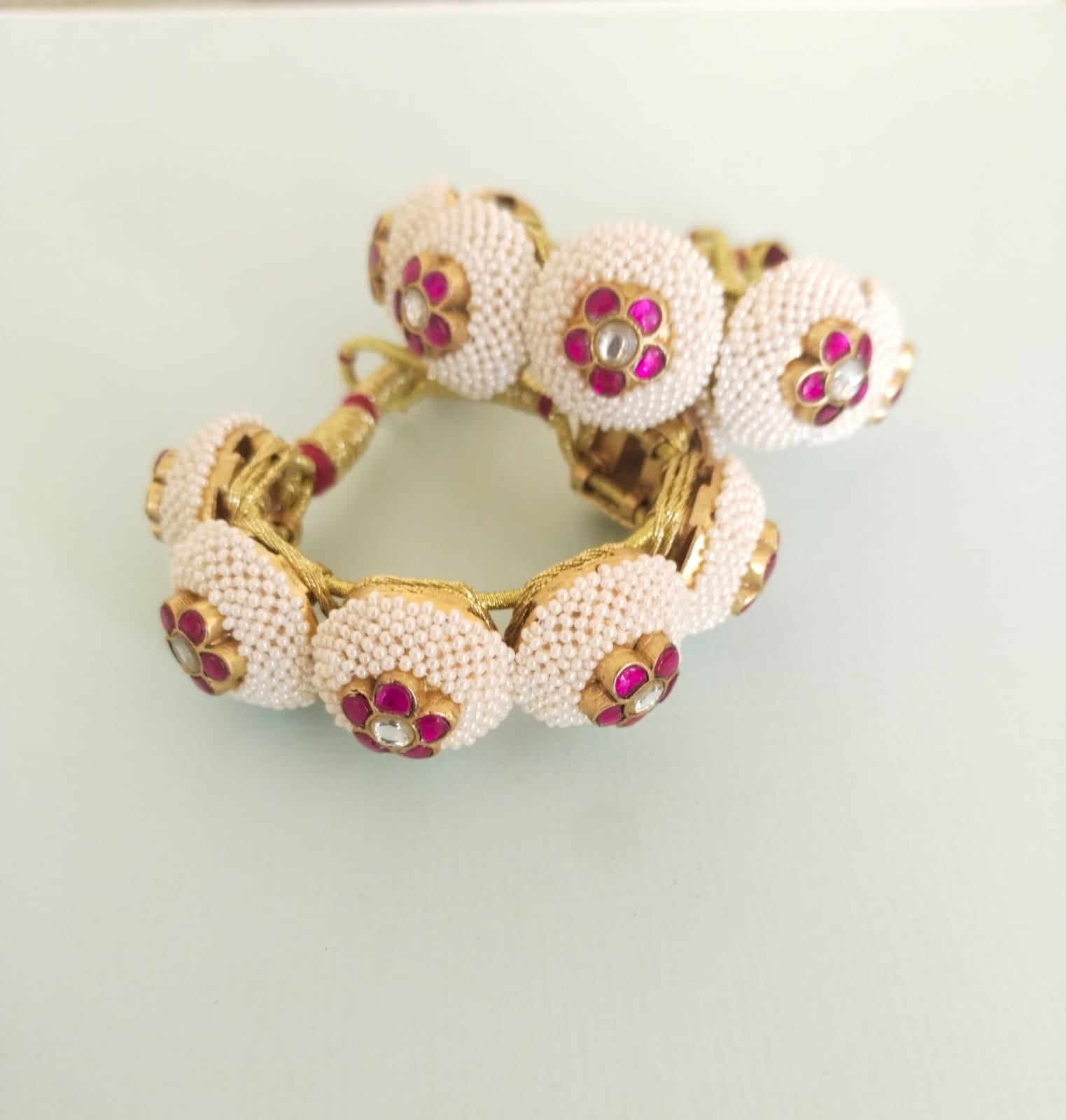 Red pearl phunchi/bracelet in 92.5 Sterling Silver handcrafted and dipped in 1 micron Gold plating with Puwain-Jadau in traditional Paunchi (Price for 1 piece).