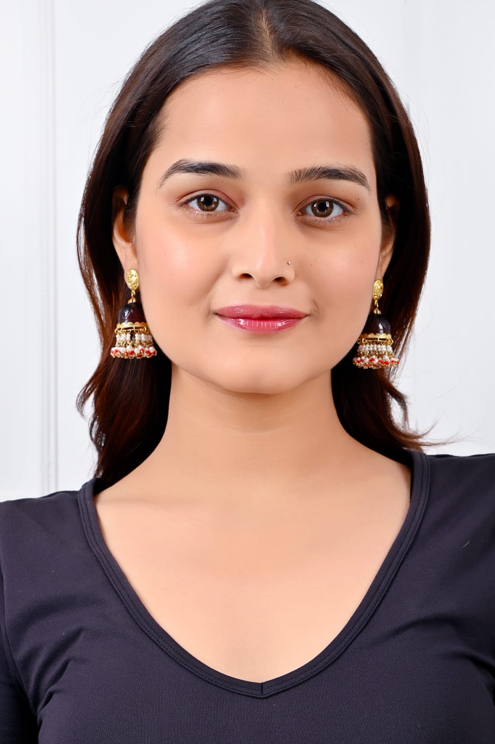 Stone Jhumka in 92.5 Sterling Silver handcrafted and dipped in 1 micron Gold plating in antique Garnet finishing in dome shape.
