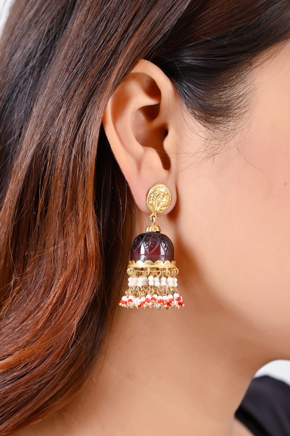 Stone Jhumka in 92.5 Sterling Silver handcrafted and dipped in 1 micron Gold plating in antique Garnet finishing in dome shape.