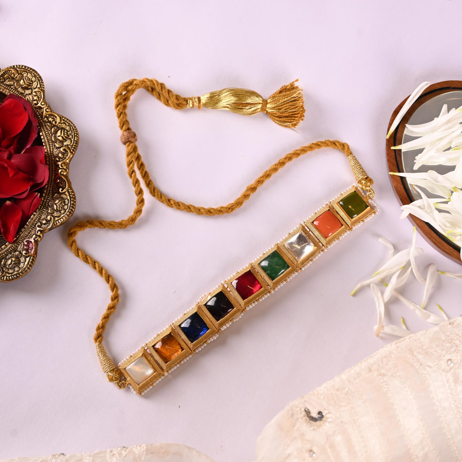 Ratna necklace in Silver Alloy handcrafted and dipped in 1 micron Gold plating with Jadau in traditional Navratna stones in antique Pearls finish.