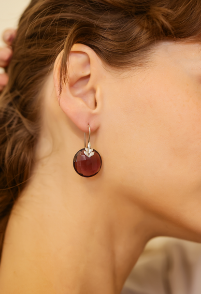 Nazara earrings in 92.5 Sterling Silver in a Silver leaf with an Amythest disk.