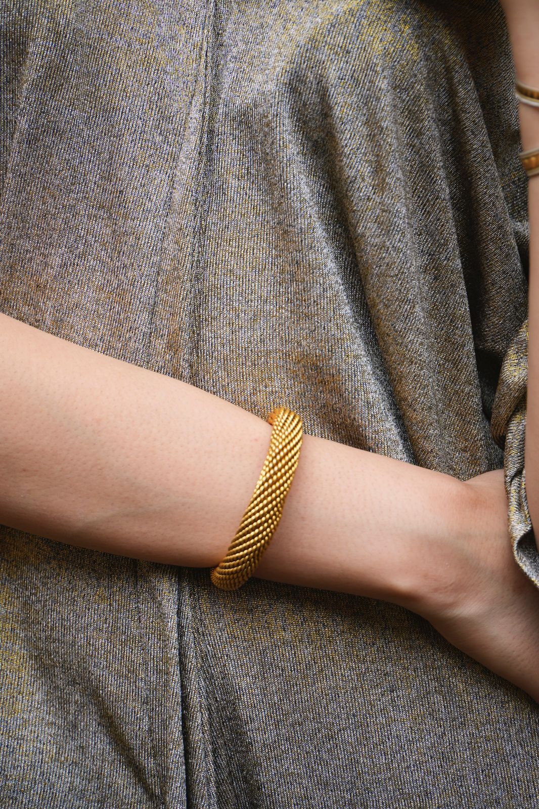 Jaali kara 
in sterling Silver with 1 micron gold plating, Strands of silver knotted together, adjustable.