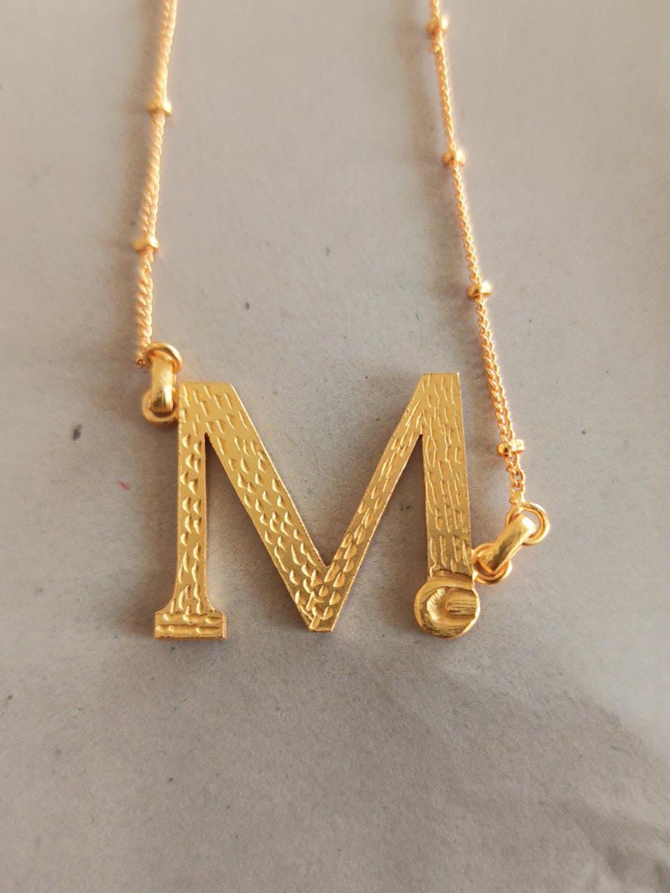 Monogram pendent chain